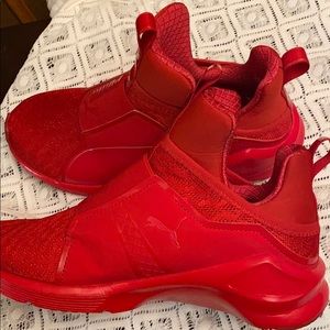 Red PUMA high tops sneakers